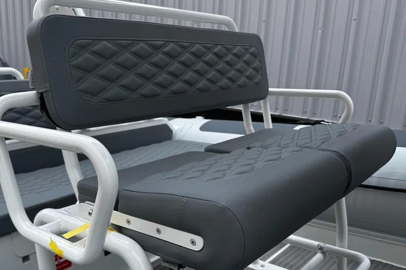 Slide: The Image of 2026 Highfield Patrol 600 boat with diamond-stitched seating, showcasing luxury and comfort. - 14