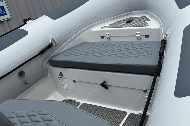 Slide: The Image of 2026 Highfield Patrol 600 boat with sleek design and modern seating. - 9