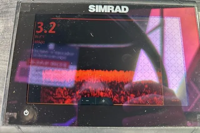 Slide: The Image of Simrad marine display on 2019 Hurricane SunDeck 2410 OB, showing sonar data and depth reading. - 10