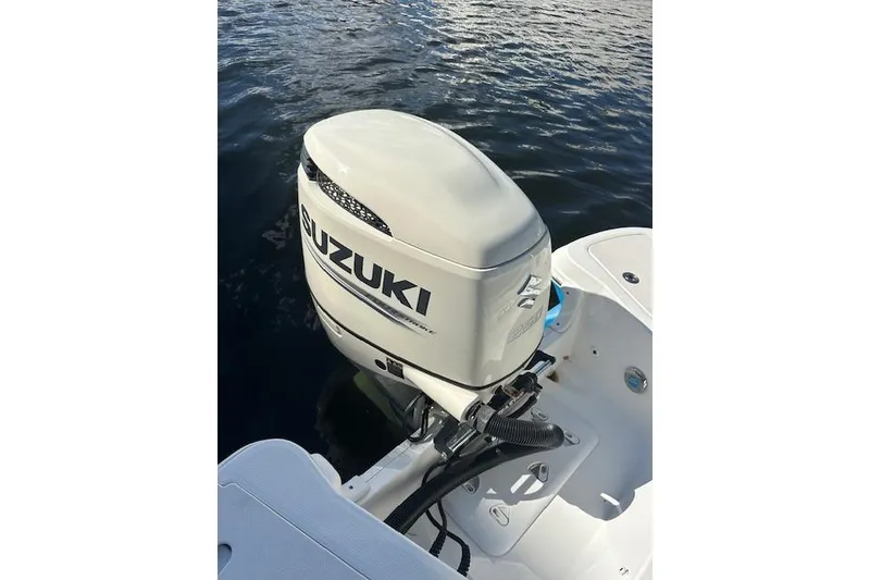 Slide: The Image of 2019 Hurricane SunDeck 2410 OB with Suzuki outboard motor on water. - 4
