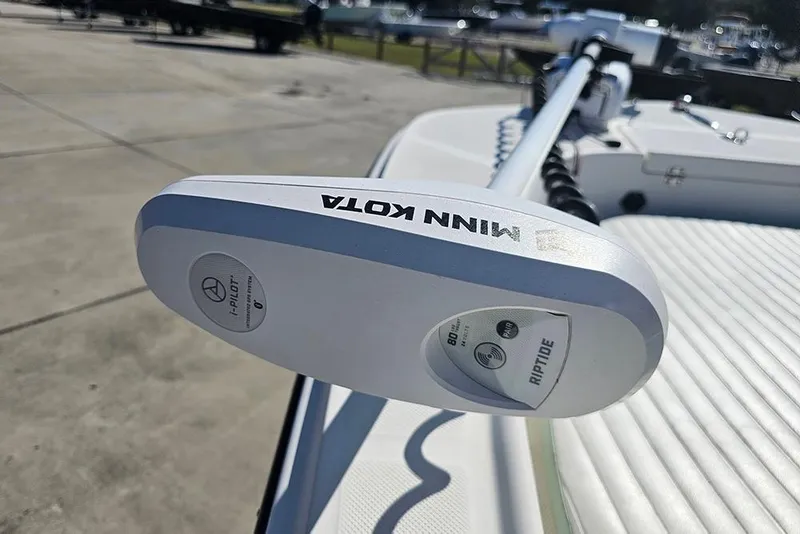 Slide: The Image of Minn Kota Riptide motor on 2016 Sundance DX20 boat, dockside view. - 22