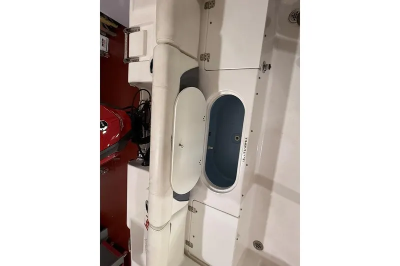 Slide: The Image of 2017 Tidewater 210 LXF boat interior with seating and storage compartments. - 12