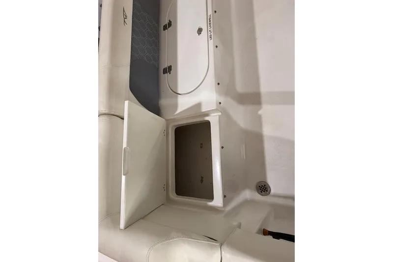 Slide: The Image of Open storage compartment on 2017 Tidewater 210 LXF boat interior. - 14