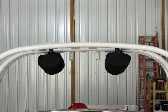 Slide: The Image of 2017 Tidewater 210 LXF boat with mounted speakers in a storage area. - 21