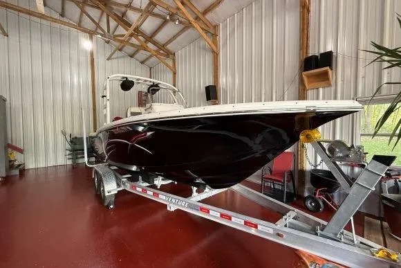 Slide: The Image of 2017 Tidewater 210 LXF boat on trailer in a metal storage building. - 4