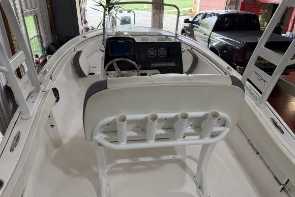 Slide: The Image of 2017 Tidewater 210 LXF boat interior with steering console and rod holders. - 9
