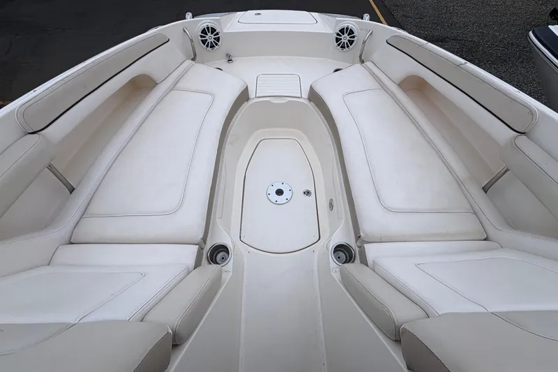 Slide: The Image of 2013 Sea Ray 280 Sundeck interior with spacious seating and cup holders. - 15