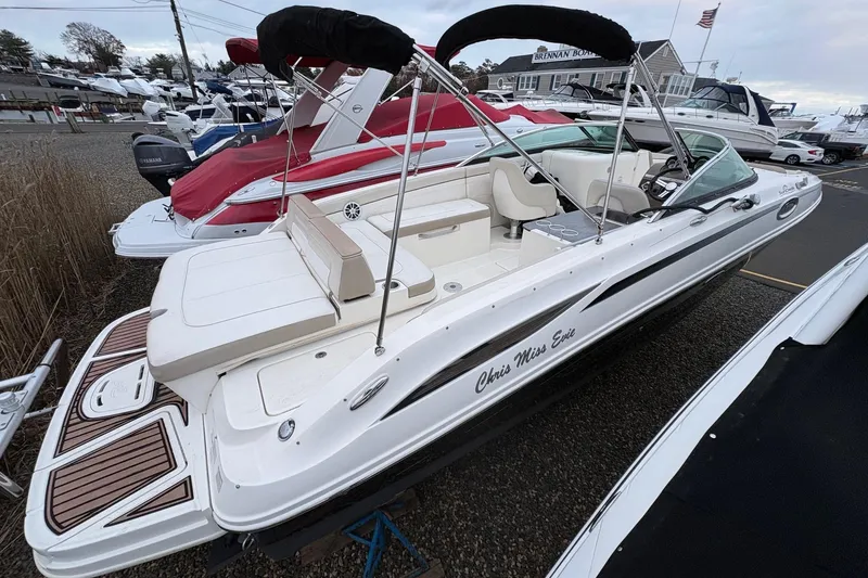 Slide: The Image of 2013 Sea Ray 280 Sundeck boat with sleek design, docked outdoors. - 7