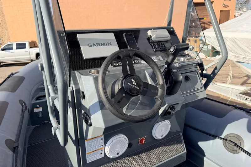 Slide: The Image of 2026 Highfield Patrol 660 boat dashboard with Garmin navigation system. - 10