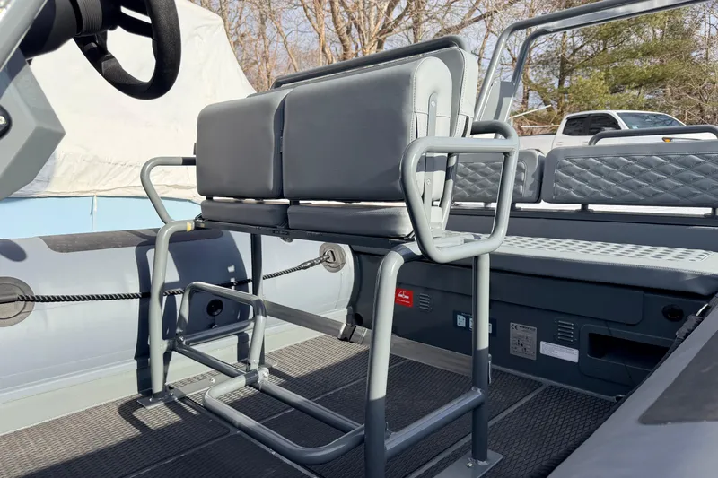 Slide: The Image of 2026 Highfield Patrol 660 boat interior with gray seating and sturdy metal framework. - 15