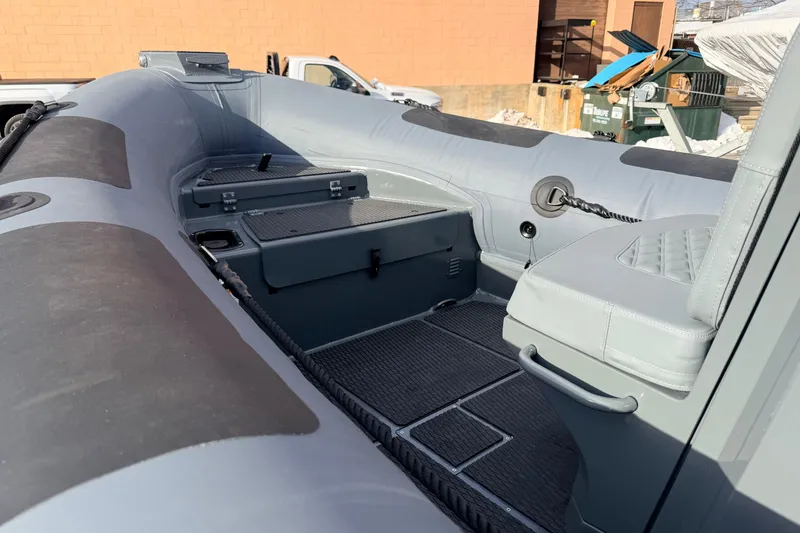 Slide: The Image of 2026 Highfield Patrol 660 boat interior with seating and storage compartments. - 18