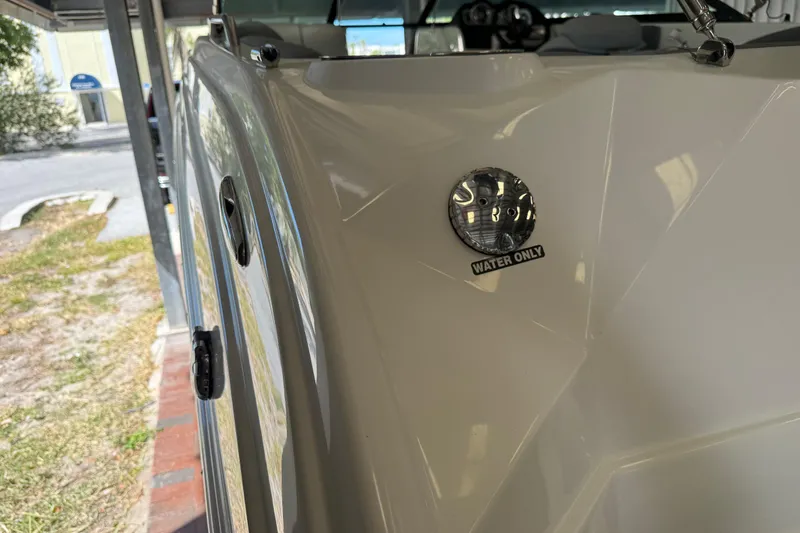 Slide: The Image of 2023 NauticStar 243 DC boat detail, featuring a "Water Only" label on the hull. - 21