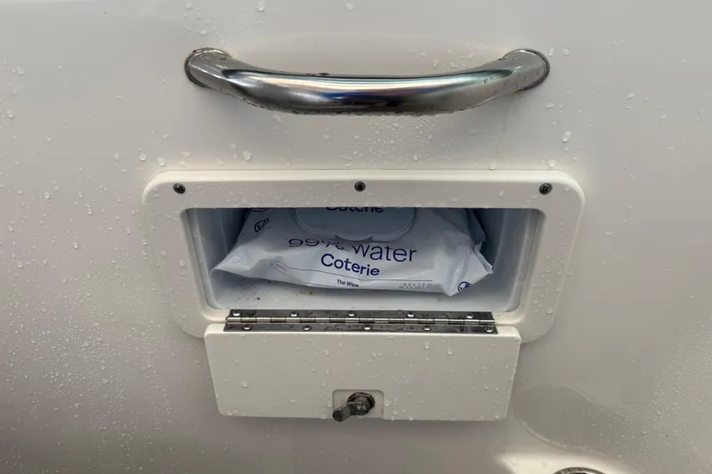 Slide: The Image of Compartment on 2023 NauticStar 243 DC boat with wet wipes inside. - 34