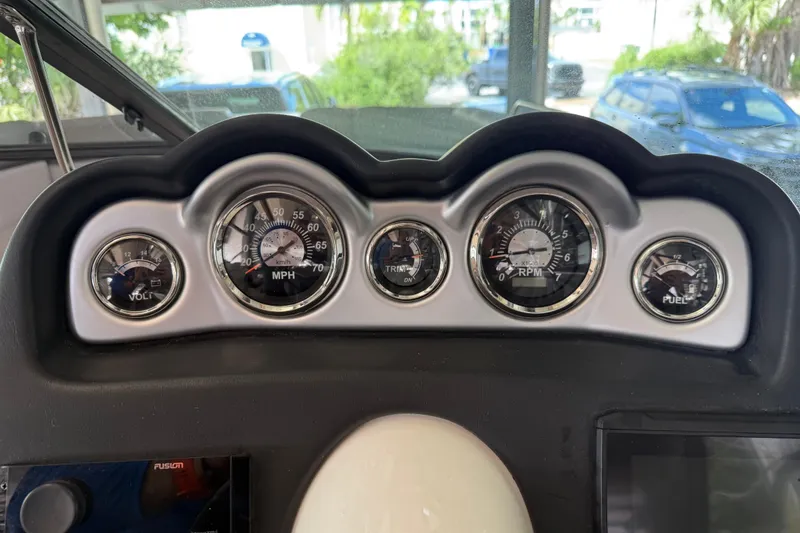 Slide: The Image of Dashboard of 2023 NauticStar 243 DC boat with speedometer, tachometer, and fuel gauges. - 40