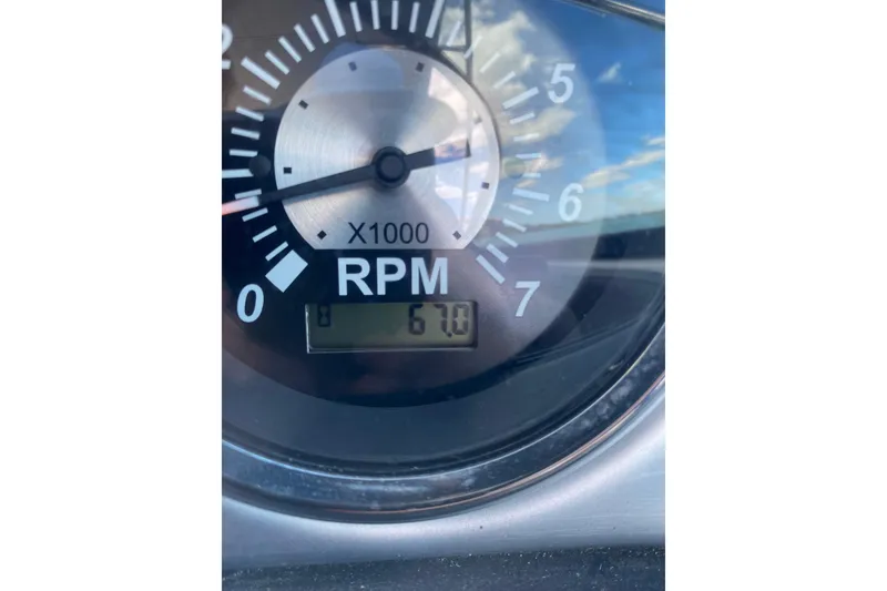 Slide: The Image of Close-up of 2023 NauticStar 243 DC tachometer showing 670 RPM. - 41