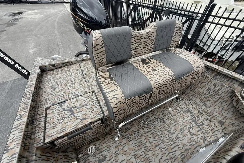 Slide: The Image of 2026 Xpress H22B Bay boat with camouflage seating and sleek design. - 12