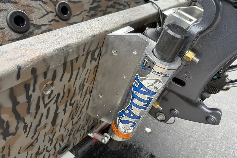 Slide: The Image of 2026 Xpress H22B Bay boat with Atlas hydraulic jack plate detail. - 15