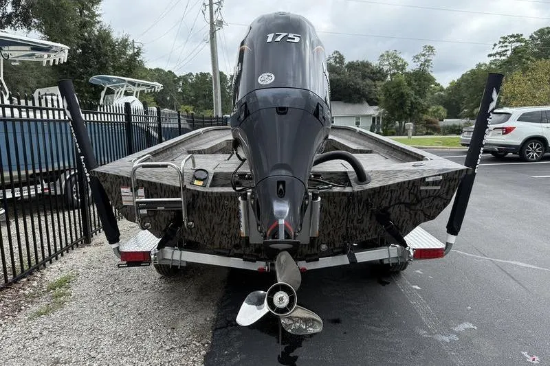 Slide: The Image of 2026 Xpress H22B Bay boat with 175 horsepower engine on trailer. - 4