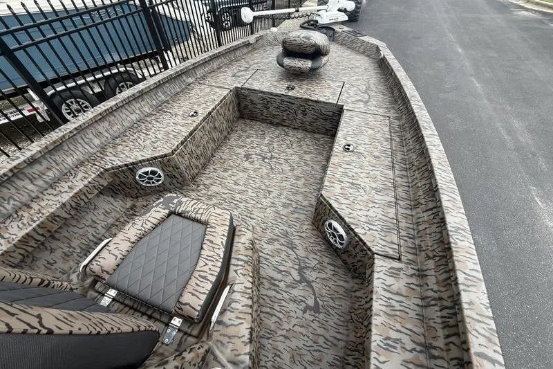 Slide: The Image of 2026 Xpress H22B Bay boat with camouflage design and spacious deck layout. - 5