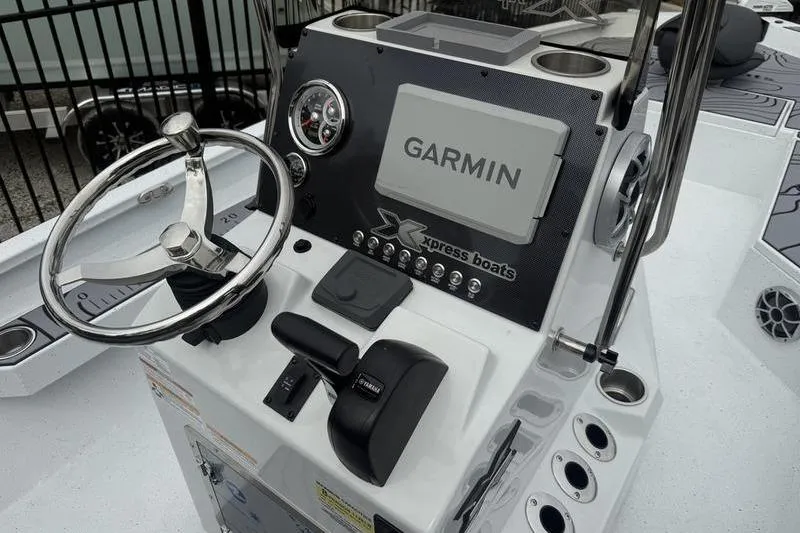 Slide: The Image of 2026 Xpress H22B Bay boat console with Garmin display and Yamaha controls. - 11