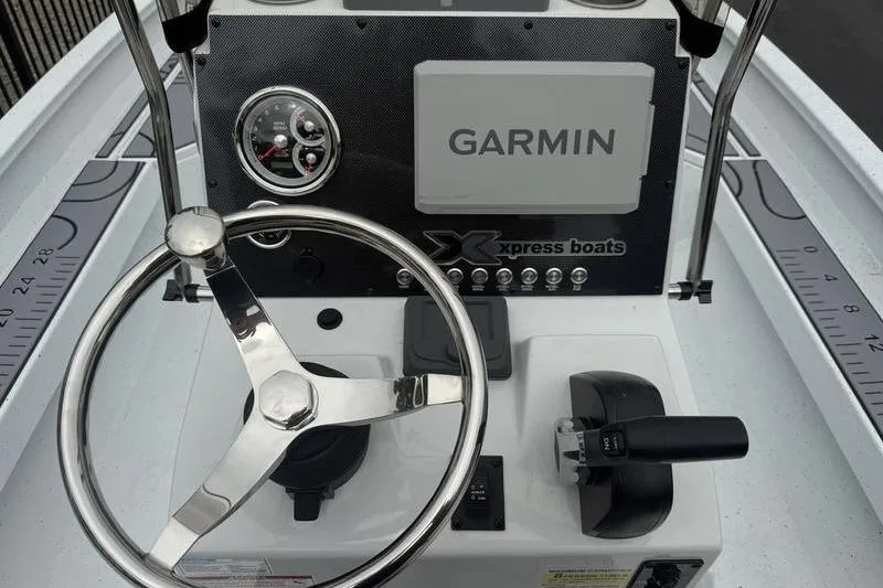 Slide: The Image of Steering console of 2026 Xpress H22B Bay boat with Garmin navigation system. - 12