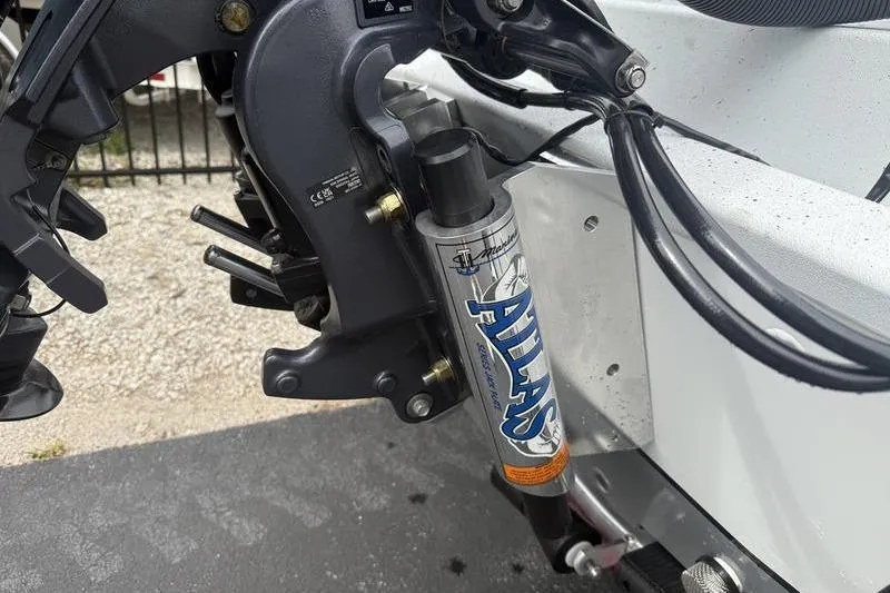 Slide: The Image of Close-up of Atlas hydraulic jack plate on 2026 Xpress H22B Bay boat. - 18