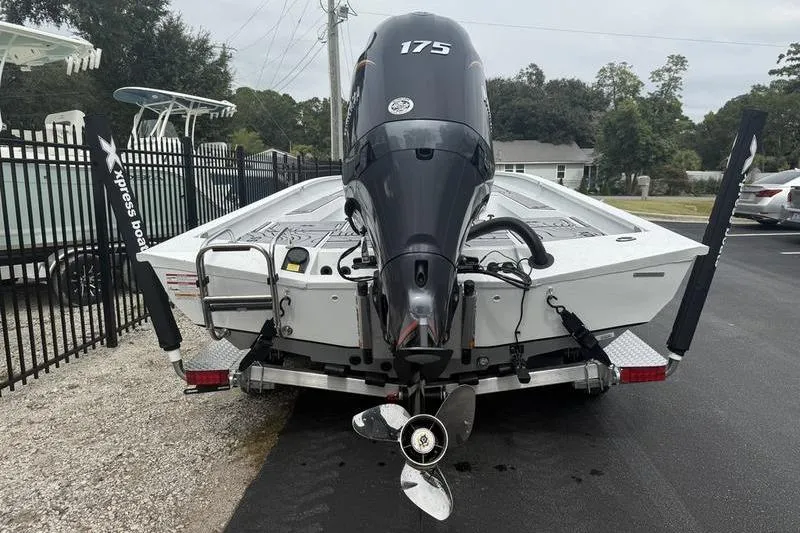 Slide: The Image of 2026 Xpress H22B Bay boat with 175 horsepower engine on a trailer. - 4