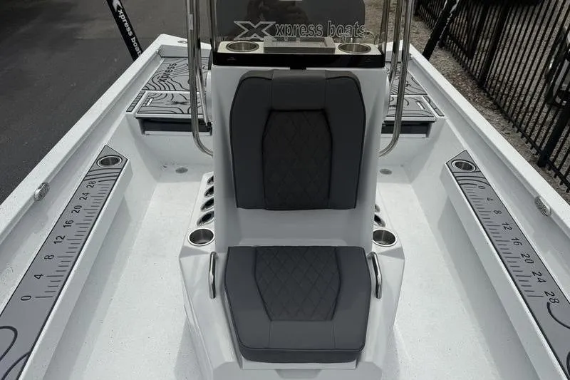 Slide: The Image of 2026 Xpress H22B Bay boat interior with dual seats and measurement markings. - 8
