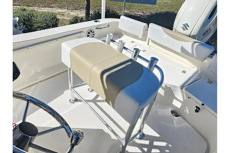 Slide: The Image of 2019 Bulls Bay 200 CC boat interior with beige and white seating and steering wheel. - 11
