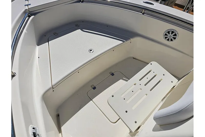 Slide: The Image of 2019 Bulls Bay 200 CC boat interior with seating and storage area. - 14