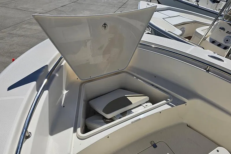 Slide: The Image of 2019 Bulls Bay 200 CC boat with open storage compartment on deck. - 15