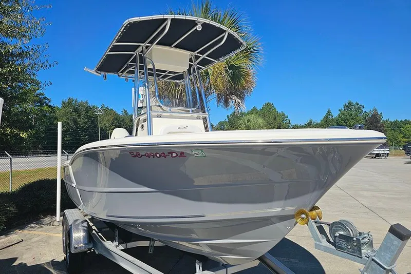 Slide: The Image of 2019 Bulls Bay 200 CC boat on trailer, parked outdoors under clear blue sky. - 5