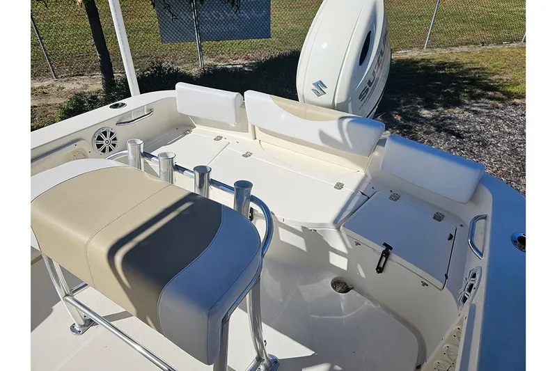 Slide: The Image of 2019 Bulls Bay 200 CC boat interior with seating and Suzuki outboard motor. - 8