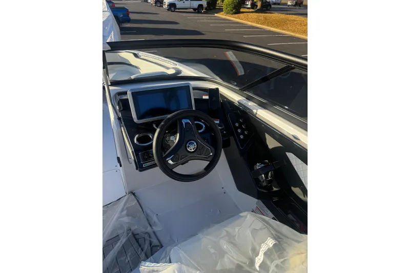 Slide: The Image of 2026 Yamaha Boats 252SD dashboard with steering wheel and touchscreen display. - 7