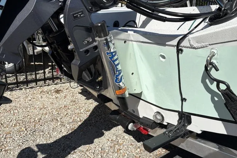 Slide: The Image of 2026 Xpress H20B Bay boat with Atlas hydraulic jack plate detail. - 15