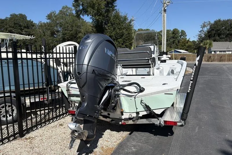 Slide: The Image of 2026 Xpress H20B Bay boat on trailer with Yamaha outboard motor. - 3