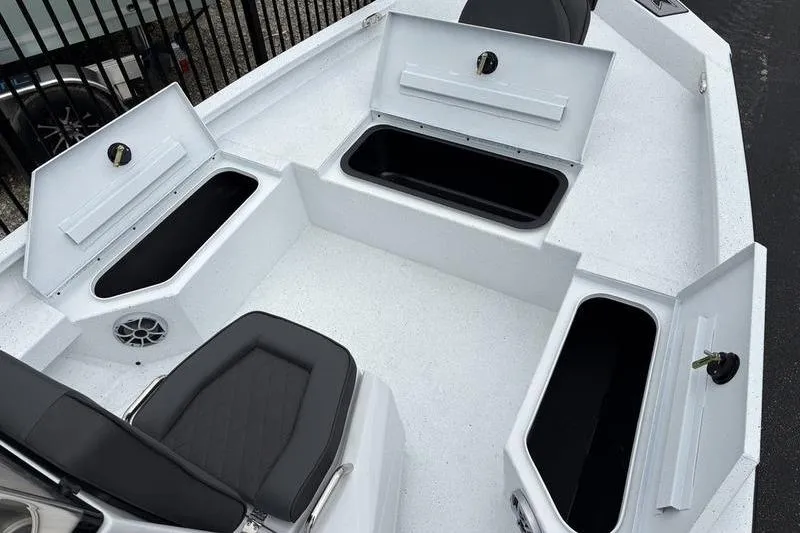Slide: The Image of 2026 Xpress H20B Bay boat interior with open storage compartments and seating. - 5