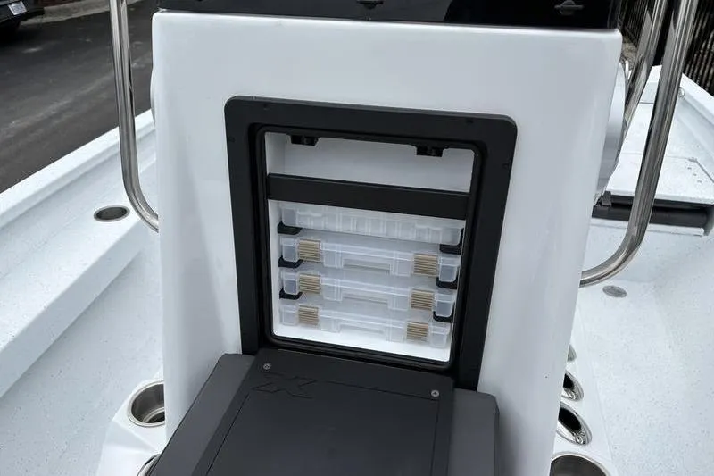 Slide: The Image of 2026 Xpress H20B Bay boat with built-in tackle storage compartment. - 8