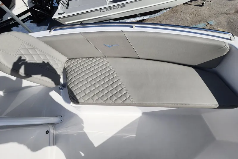 Slide: The Image of 2025 Savannah 2200 Offshore boat with gray quilted seating and sleek design. - 10