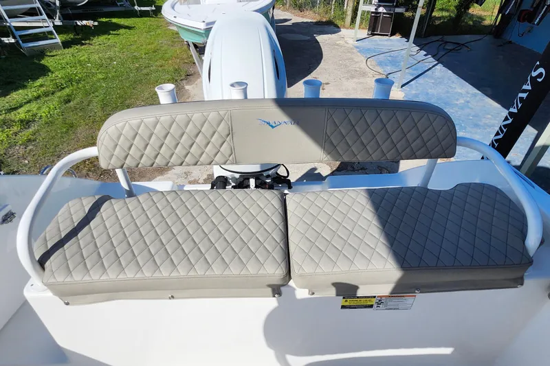 Slide: The Image of 2025 Savannah 2200 Offshore boat with quilted seating, outdoor setting. - 23
