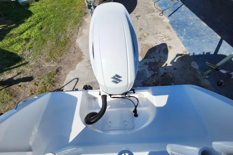 Slide: The Image of 2025 Savannah 2200 Offshore boat with Suzuki outboard motor, viewed from above. - 26