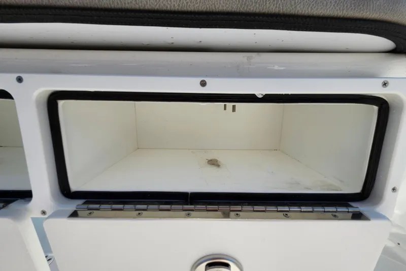 Slide: The Image of Storage compartment on a 2025 Savannah 2200 Offshore boat, featuring a clean, open interior. - 29
