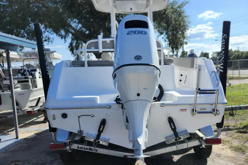 Slide: The Image of 2025 Savannah 2200 Offshore boat with powerful outboard motor, parked on a trailer. - 5