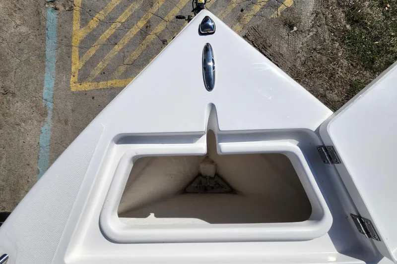 Slide: The Image of Bow storage compartment of 2025 Savannah 2200 Offshore boat, open and empty. - 9