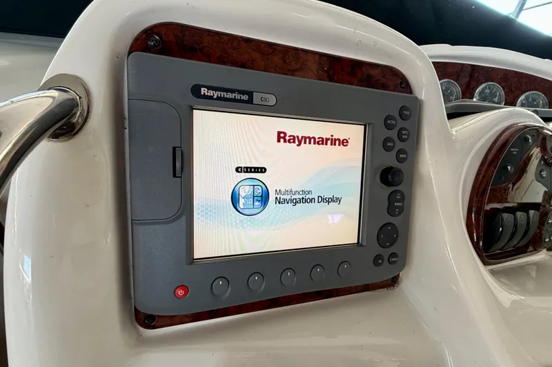 Slide: The Image of Raymarine navigation display on 2004 Sea Ray 320 Sundancer boat dashboard. - 17
