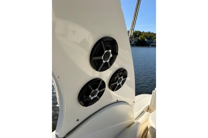 Slide: The Image of Speakers on a 2004 Sea Ray 320 Sundancer boat, with water in the background. - 27