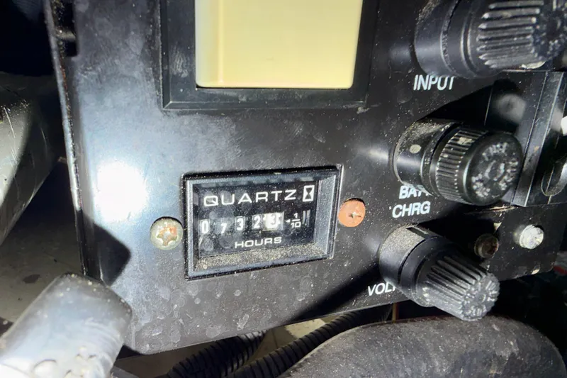 Slide: The Image of Control panel of a 2004 Sea Ray 320 Sundancer with hour meter reading 732.3 hours. - 49