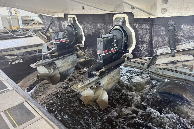 Slide: The Image of 2004 Sea Ray 320 Sundancer with Mercury outboard motors in water. - 50