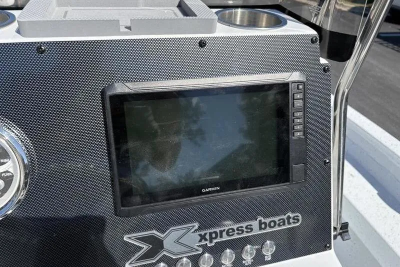Slide: The Image of Dashboard of 2026 Xpress H20B Bay boat with Garmin display. - 13