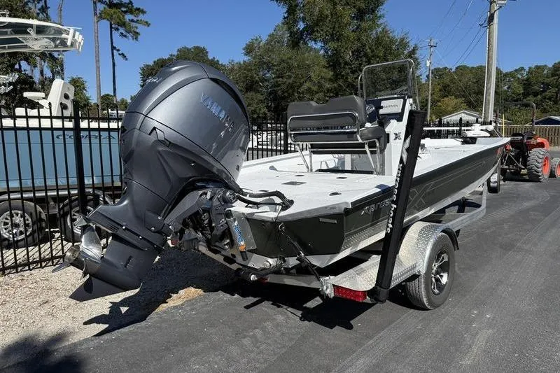 Slide: The Image of 2026 Xpress H20B Bay boat on trailer with Yamaha outboard motor. - 4